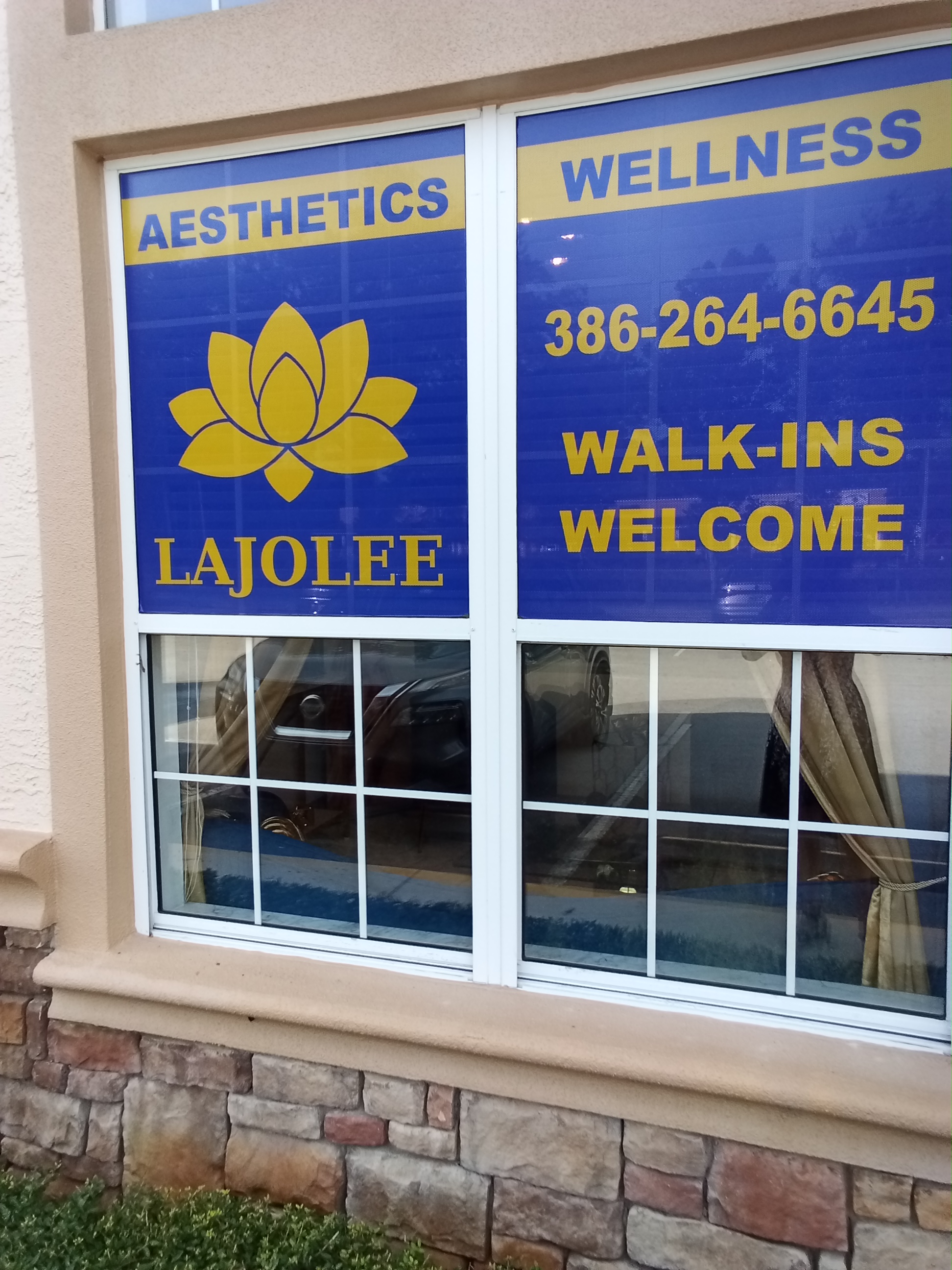 LaJolee Aesthetics storefront with blue and gold branding